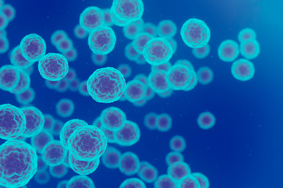 Cancer cells under microscope on blue background